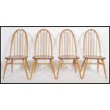 A set of four Ercol light coloured beech and elm framed Windsor, high hoop, spindled back dining