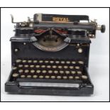A vintage early  20th century typewriter by Royal with glass panels to side, logo for Royal to