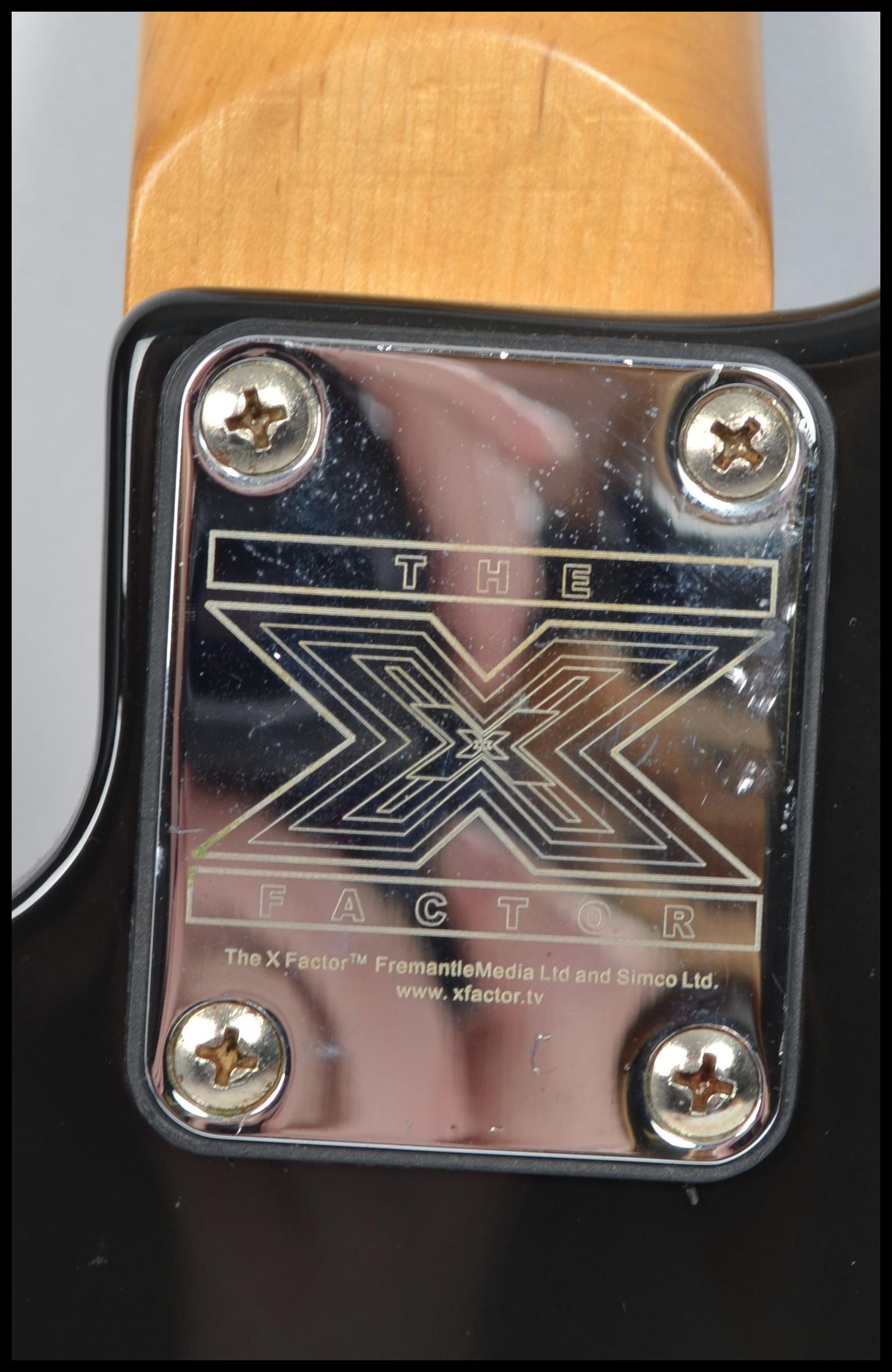 A vintage Jaxville six string electric guitar musical instrument having an X shaped body with burned - Image 7 of 7