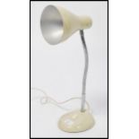 A vintage retro 20th century goose-neck / anglepoise desk lamp. Raised on a circular base with a