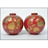 A pair of 19th century Victorian Royal Crown Derby red and gold hand painted ball vases, each with