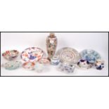A collection of Chinese and oriental ceramics to include a famille rose salt glaze vase, square