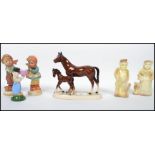 A collection of vintage ceramic figures dating from the 19th century to include a pair of vintage