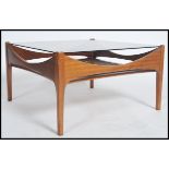 A rare 1970's large G-Plan teak and rattan weave coffee table of square form having shaped
