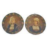 A pair of 19th century painted tin toleware wall plaques each being adorned with central classical