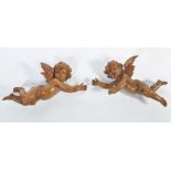 A stunning pair of 19th century carved swiss / black forest wooden cherubs - putti. Each of winged