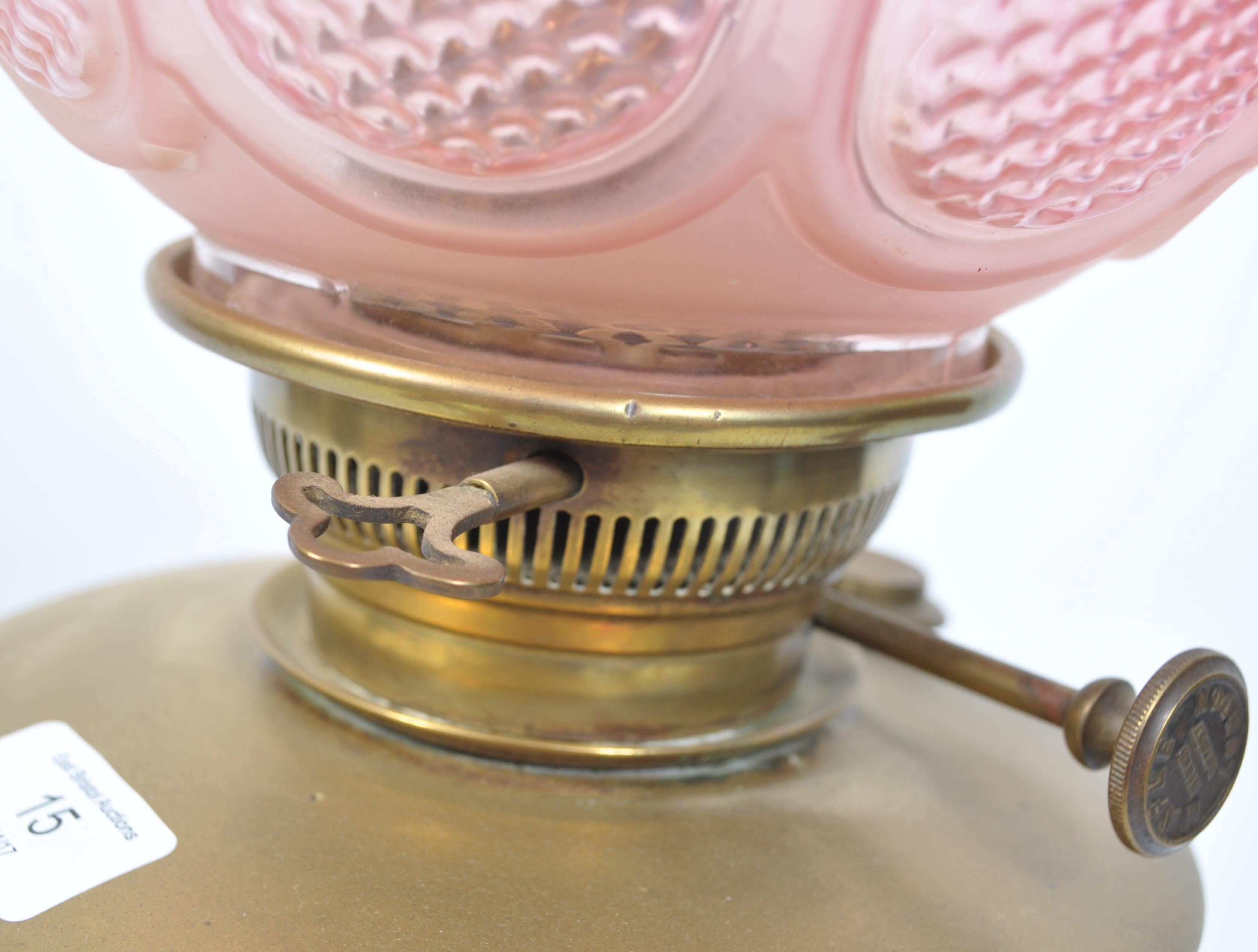 A late 19th century Victorian brass oil lamp and shape by Maple & Co, London. The brass lamp with - Image 6 of 7
