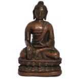 An 18th century small Nepalese / Chinese coppery bronze hollow cast figure sculpture of a buddha -