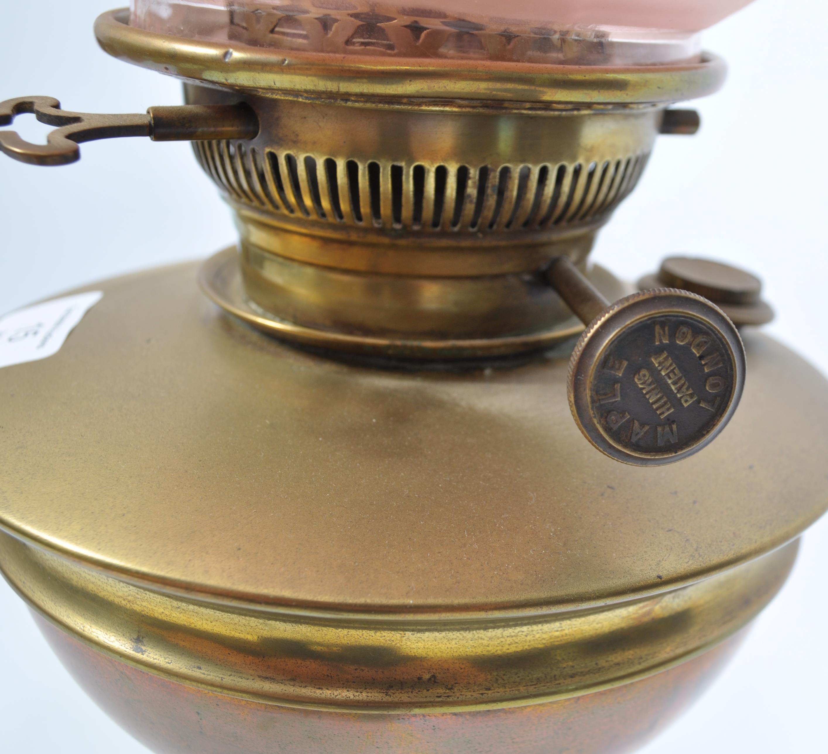 A late 19th century Victorian brass oil lamp and shape by Maple & Co, London. The brass lamp with - Image 5 of 7