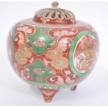 A 19th century Chinese / Japanese tri-colour ball base raised on tripod feet having cartouche