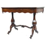 An exquisite 19th century rosewood writing table desk. Raised on hexagonal baluster columns united