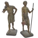 After Jean-Didier Debut (French, 1824-1893): Porteur d'eau Tunisien, a pair of bronze spelter