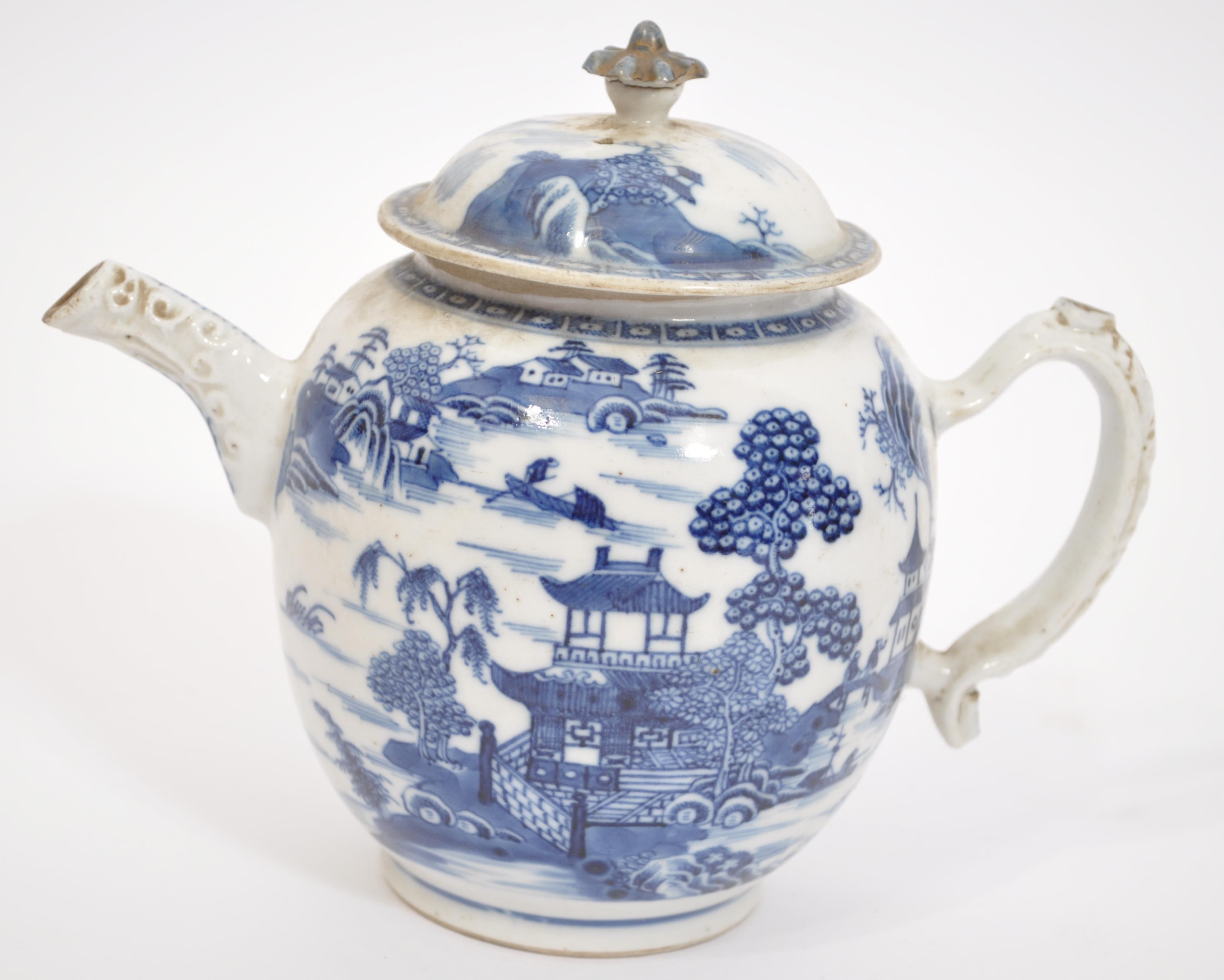 An 18th century Chinese blue and white teapot in the willow pattern. The teapot with scene of