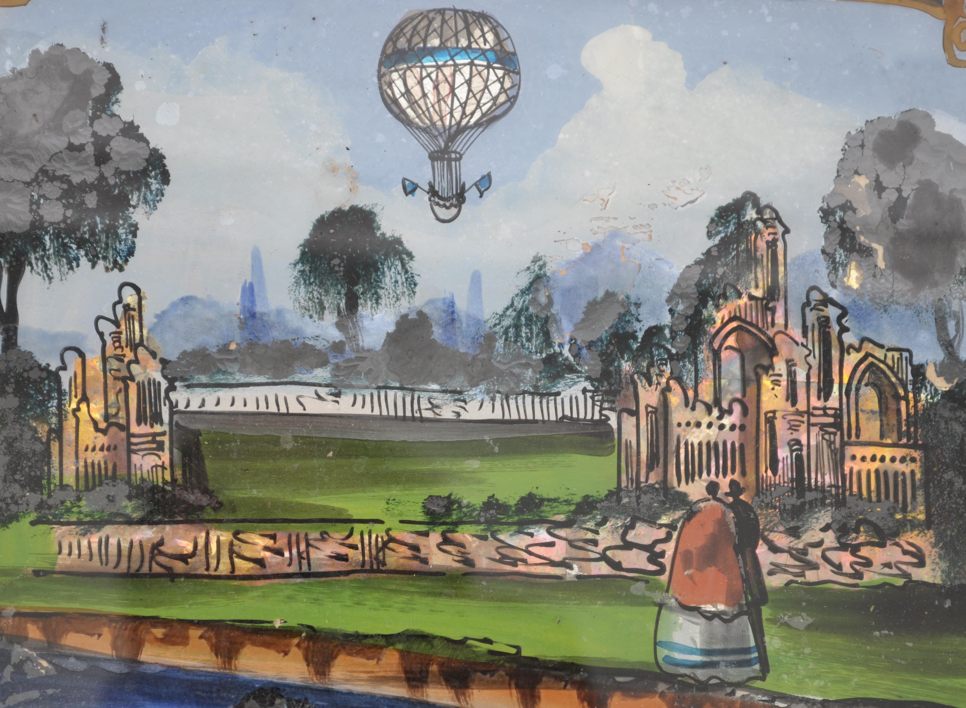 A 19th century Crystoleum painting / reverse on glass depicting a scene of a hot air balloon over