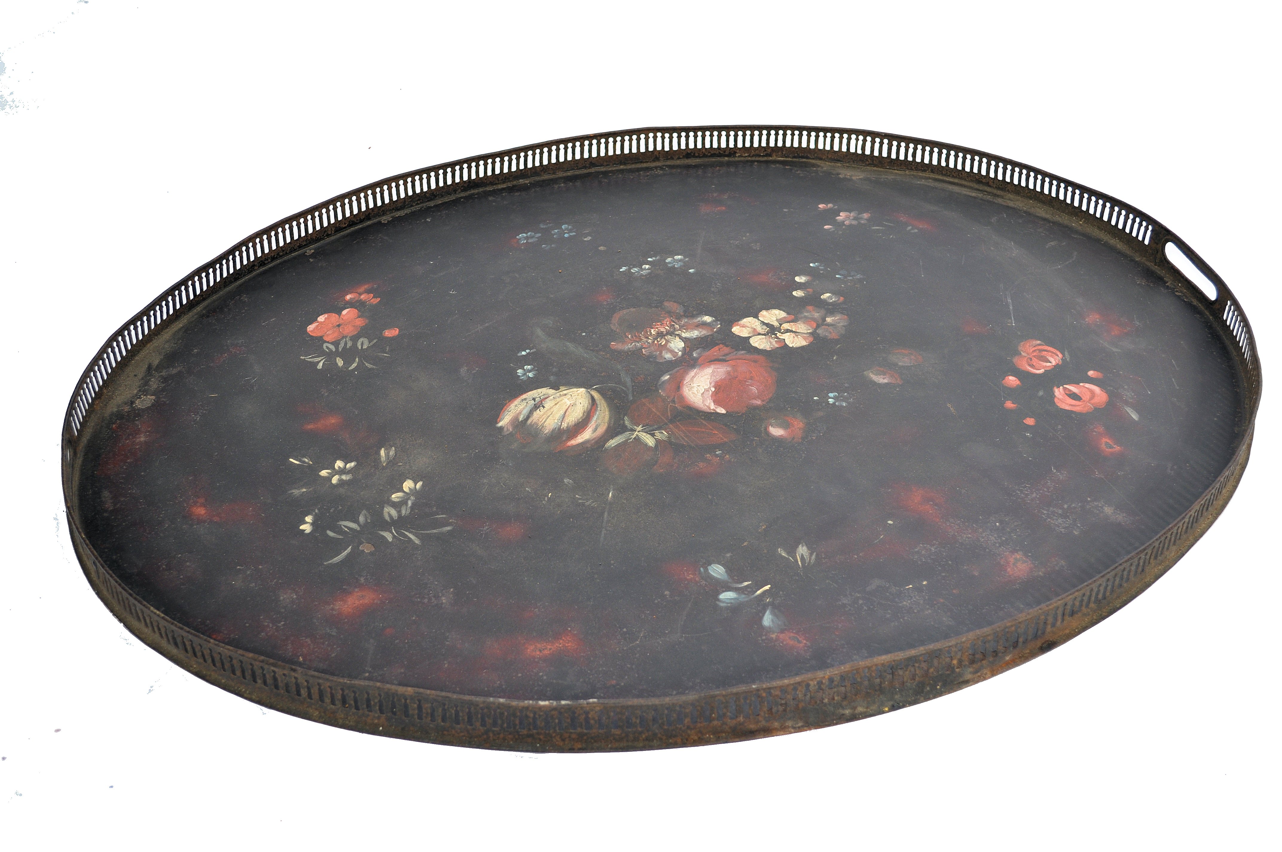 A late 18th century Georgian Pontypool Japanned tray of oval form having a black ground with painted