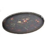 A late 18th century Georgian Pontypool Japanned tray of oval form having a black ground with painted