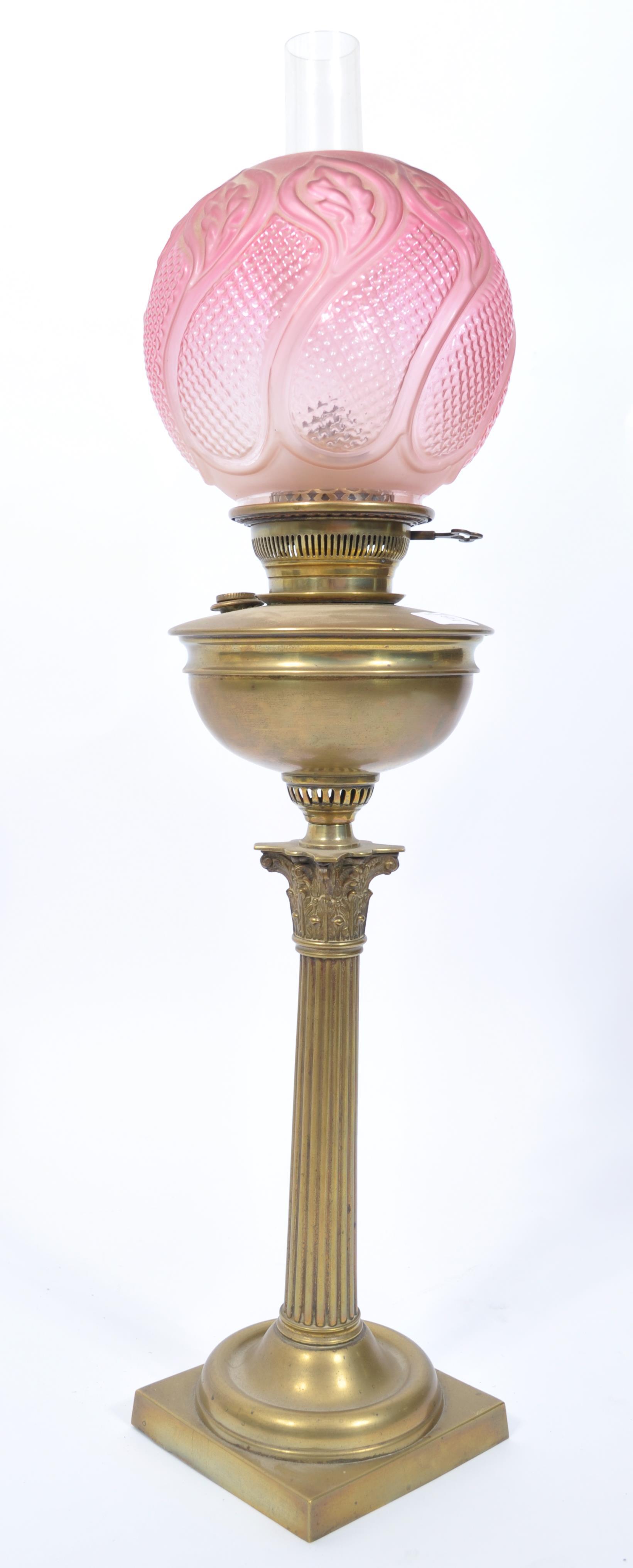 A late 19th century Victorian brass oil lamp and shape by Maple & Co, London. The brass lamp with