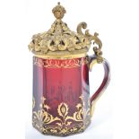 An exceptional 19th century cranberry glass and git metal ormulu mounted lid tankard. The
