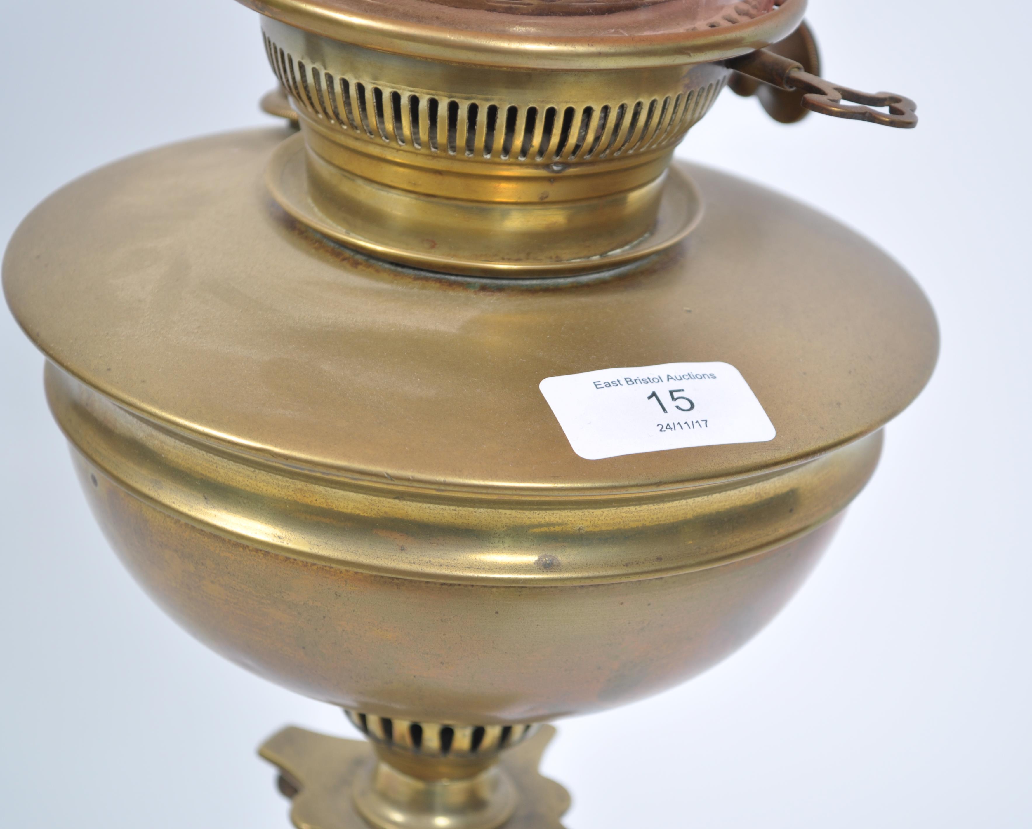 A late 19th century Victorian brass oil lamp and shape by Maple & Co, London. The brass lamp with - Image 4 of 7