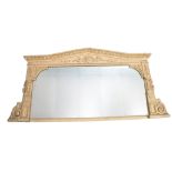 A 19th century Architectural gilt painted wall mirror of large and wide form having scrolled columns