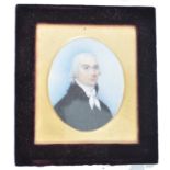 A 19th century portrait miniature painting on ivory plaque depicting a young parson - gentleman. .