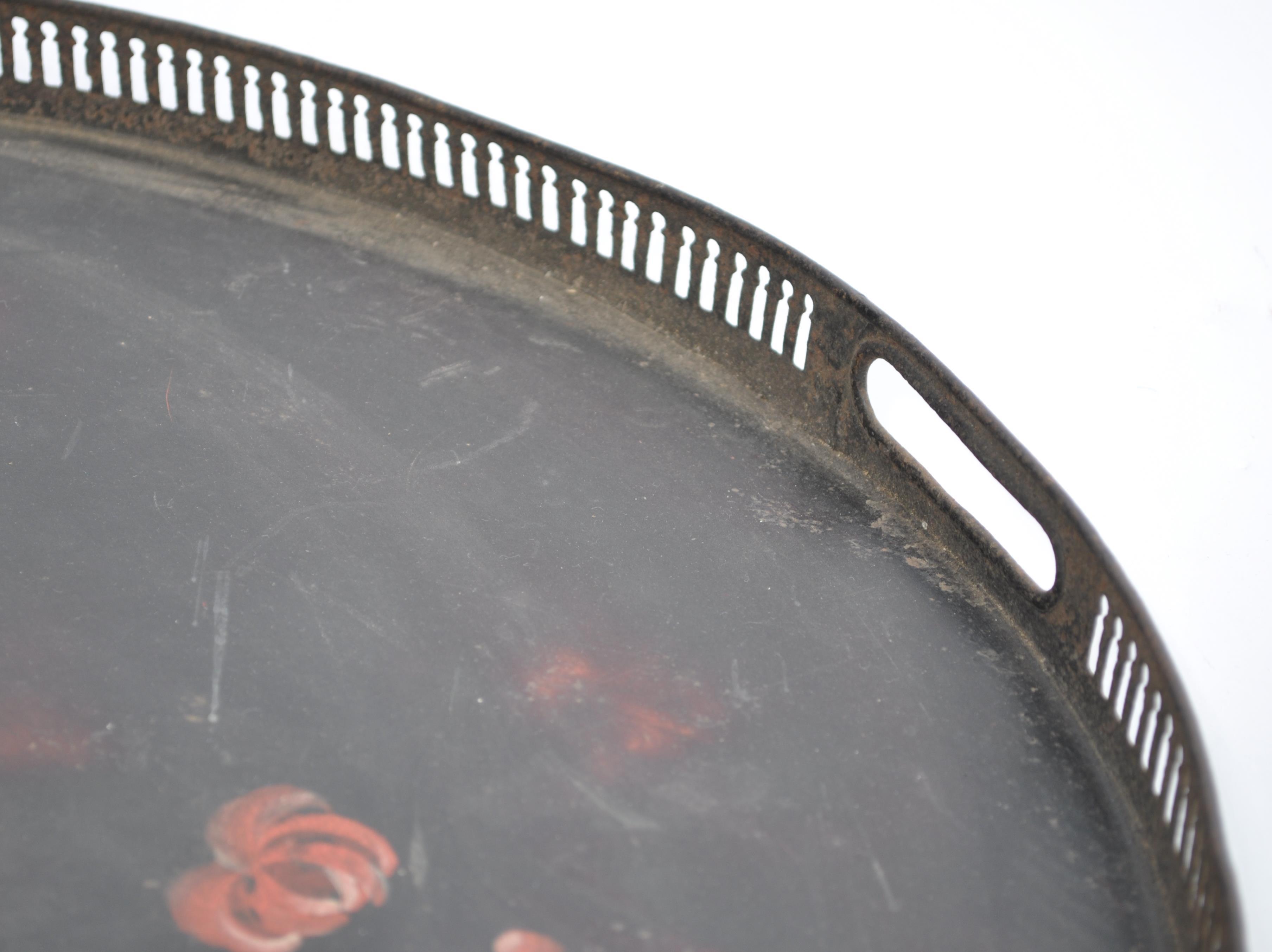 A late 18th century Georgian Pontypool Japanned tray of oval form having a black ground with painted - Image 4 of 6