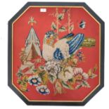 A 19th / 20th century needlework panel of vibrant colour and form. The octagonal panel on red ground