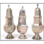 A set of three silver hallmarked pepperette's / si