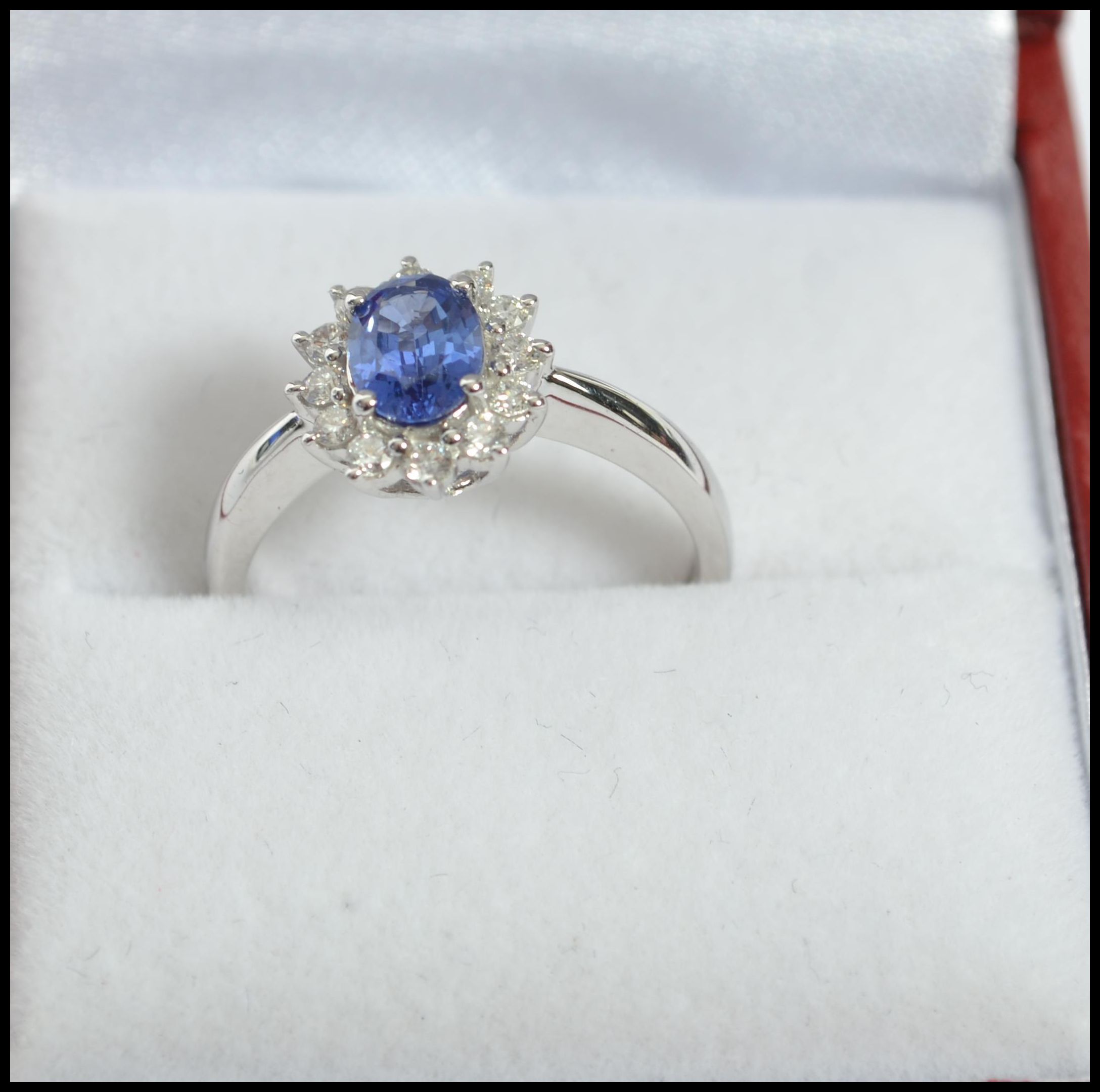 An 18ct white gold sapphire and diamond halo clust - Image 2 of 5