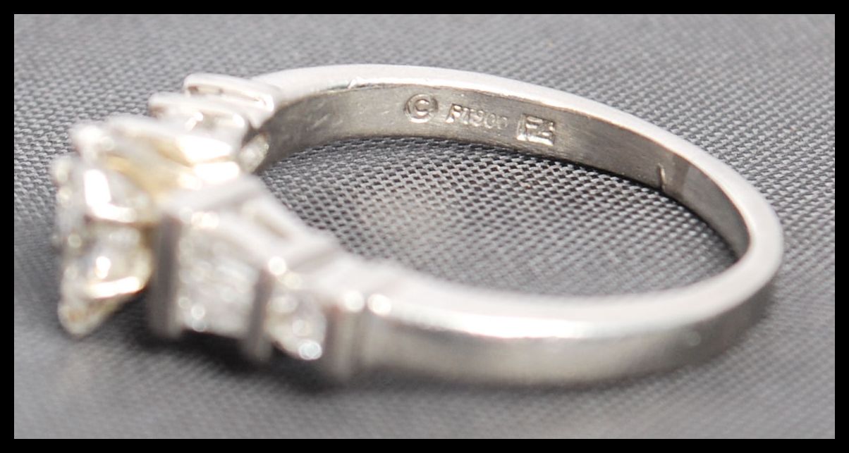 A 900 platinum and diamond ring. The ring having a - Image 4 of 5