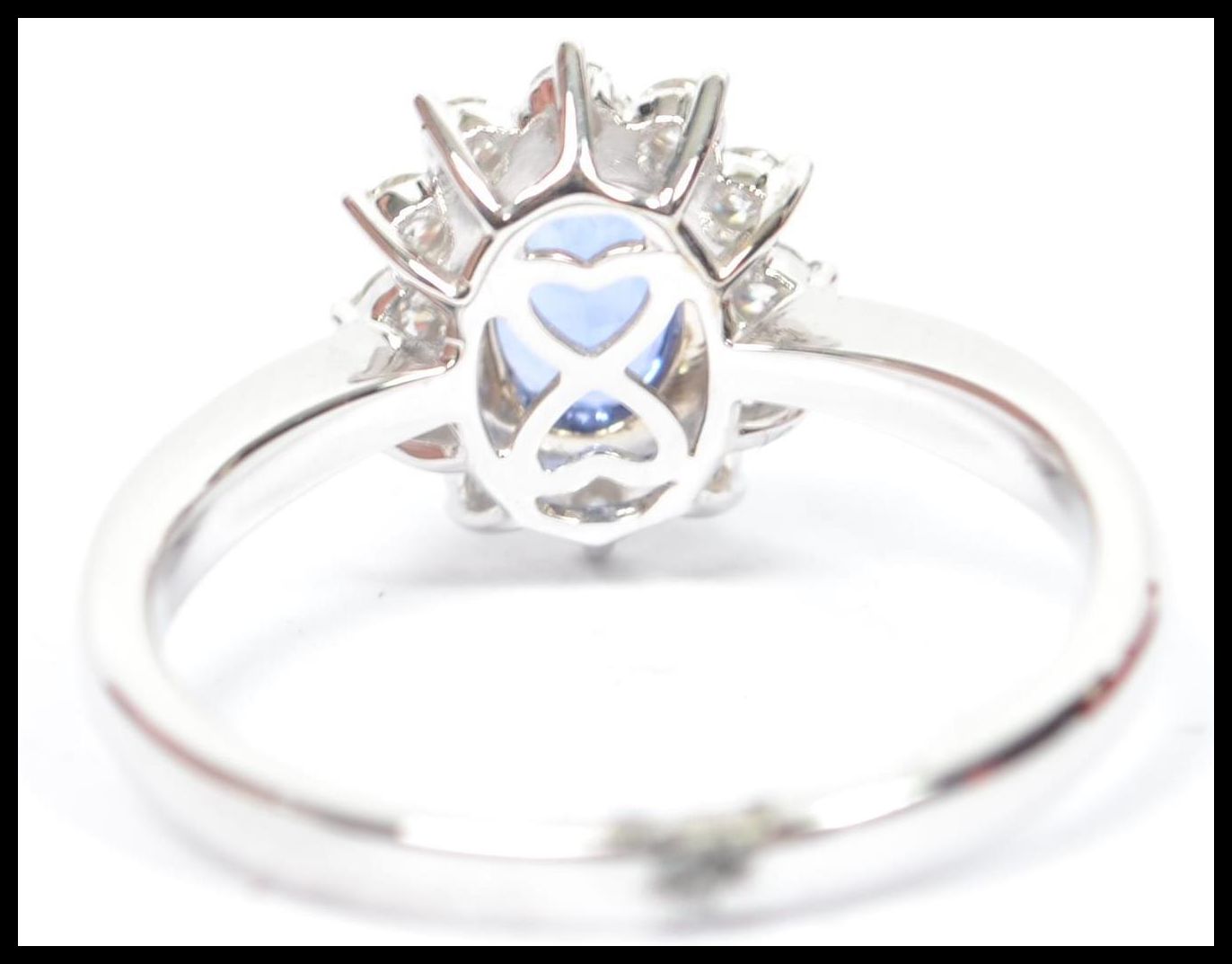 An 18ct white gold sapphire and diamond halo clust - Image 4 of 5