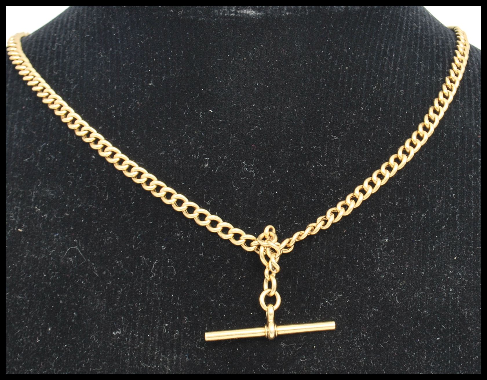 An 18ct gold watch T bar chain marked 18ct , tests