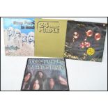 A collection of four long play Lp vinyl records by