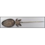 An 18th century silver Tupu dress shawl pin in the