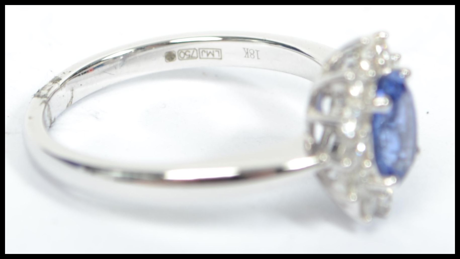 An 18ct white gold sapphire and diamond halo clust - Image 5 of 5