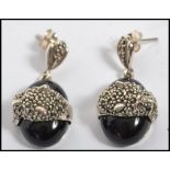 A pair of contemporary silver and marcasite onyx e