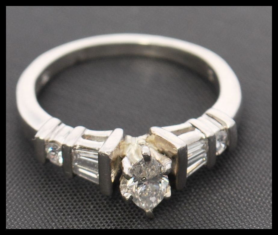 A 900 platinum and diamond ring. The ring having a - Image 2 of 5