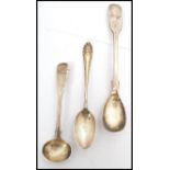 A group of three silver metal spoons, two hallmarked spoons to include a teaspoon with London