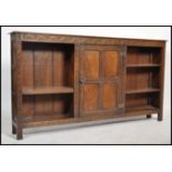A late 19th /  early 20th century oak Jacobean revival open window large bookcase cabinet being