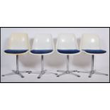 A set of four Swivel chairs / dining chairs marked