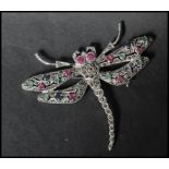 A 925 silver figural brooch in the form of  a dragon fly set with marcasite with green and red