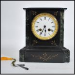 A 19th century Victorian marble and slate mantel clock, eight day movement striking on a bell. Roman