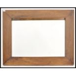 A large 20th century oak framed overmantel mirror. The central panel housed in a good wooden frame.