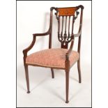 A good late 19th century mahogany and seaweed inlaid chippendale carver armchair. Raised on square