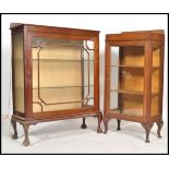 An Edwardian mahogany bookcase / display cabinet being raised on cabriole legs having twin astagal
