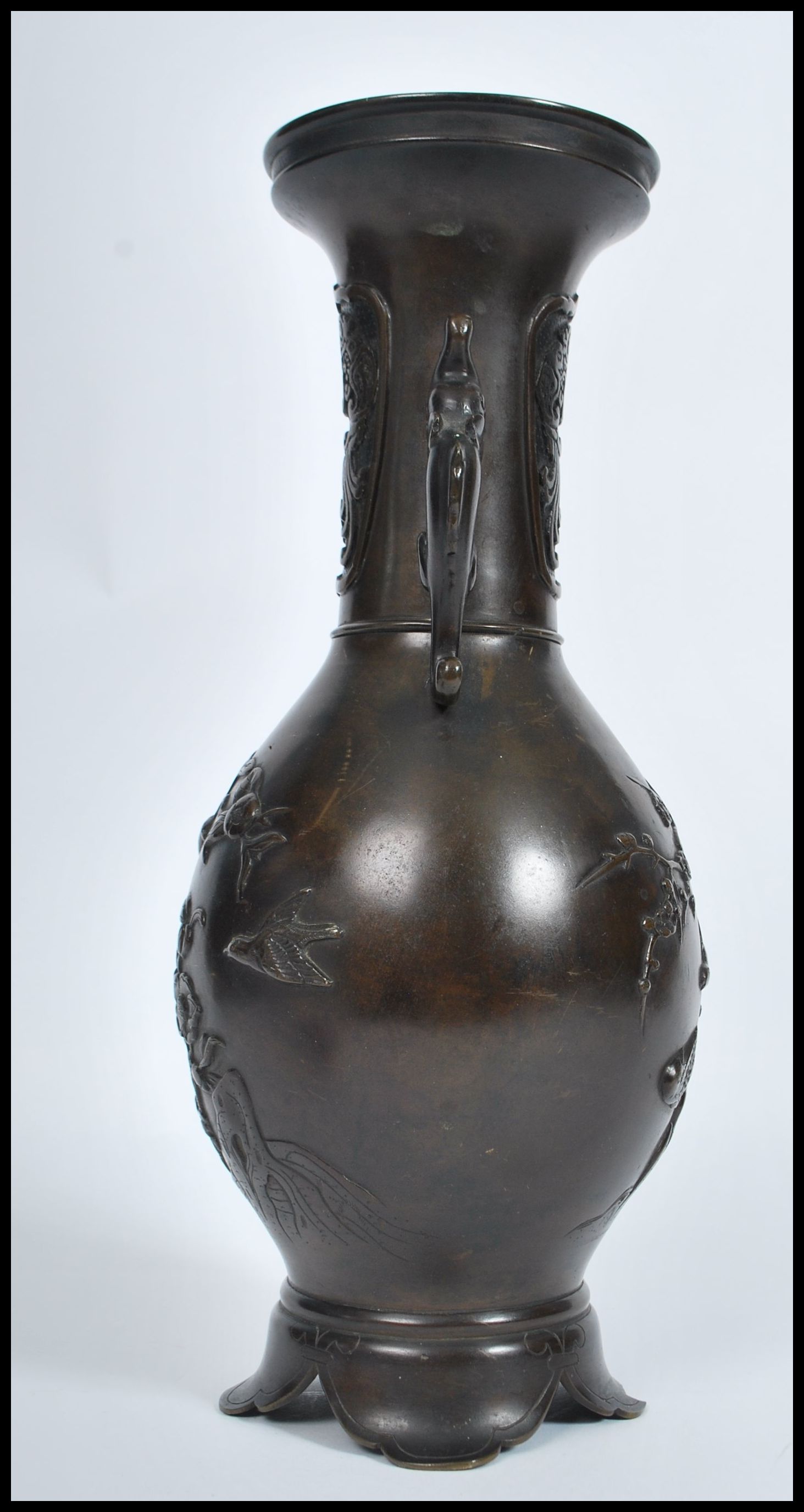 A Meji period Japanese bronze two handled vase of typical baluster form, decorated in relief with - Image 4 of 6