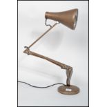 A Herbert Terrry Industrial anglepoise desk lamp raised on terraced base with pendant shade in an