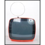 A vintage retro 1970s Indeset portable television finished in a vibrant orange complete with the