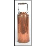 An early 20th century copper airy milk churn having swing handle atop.  measures 37cms high x