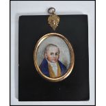 A 19th century watercolour on ivory miniature painting of a young man, set within an ebonised